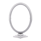 Oval aluminium photo frame with a support stand, in nickel matte colour.